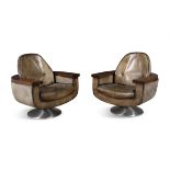 PETER HOYTE A pair of armchairs by Peter Hoyte in rosewood and leather, on a brushed aluminium