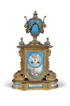 A FRENCH GILTMETAL AND PORCELAIN MANTLE CLOCK, 19TH CENTURY surmounted with the classical urn
