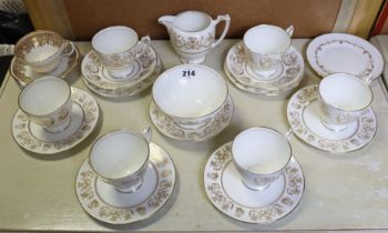 A Coalport bone china nineteen-piece part tea service of white ground & with gilt decoration; a