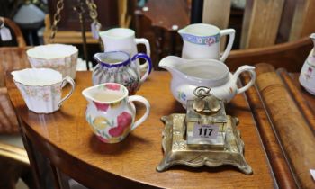 A brass desk inkstand fitted with a glass inkwell; together with various items of decorative china &