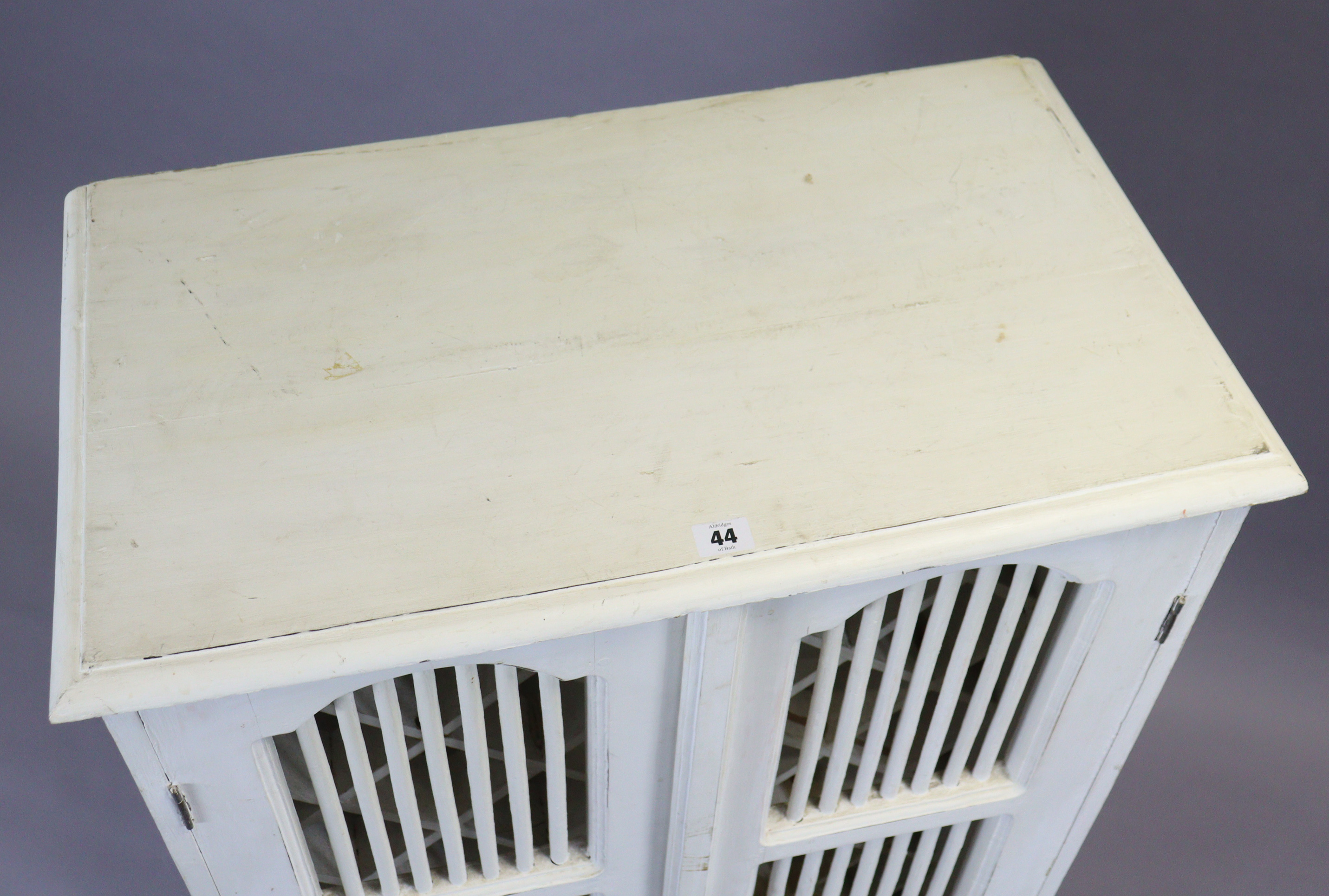 A continental-style white painted wooden upright cabinet fitted with a wine-rack enclosed by a - Image 4 of 4