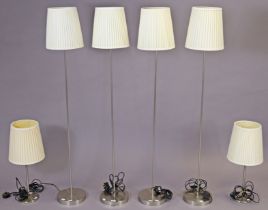 A set of four Habitat silvered-metal standard lamps, and a similar pair of IKEA table lamps.