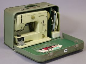 A Bernina electric sewing machine with a fibre-covered case