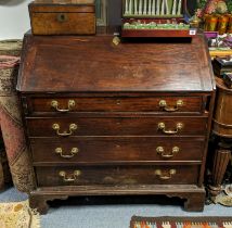 A Georgian mahogany bureau (for restoration) having a fitted interior enclosed by a fall-front above