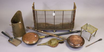 An iron & brass fireguard, 75.5cm long; two warming pans; & various other items of metalware.