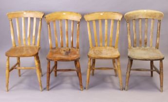 A matched set of four lath-back kitchen chairs each with a hard seat, & on turned legs with