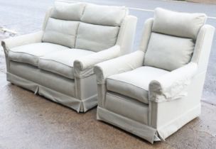 A Wesley Barrell wing-back two-seater settee with loose cushions to the seat & back upholstered grey
