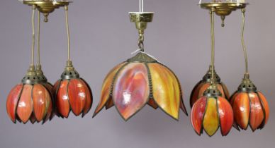 An orange mottled glass ceiling light fitting, 26cm diameter; & a similar set of smaller ceiling