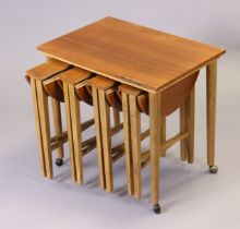 A mid-20th century Danish nest of five wooden occasional tables (four circular drop-leaf tables unde