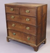 A Georgian oak & pine chest fitted two short & three long graduated drawers with brass swing