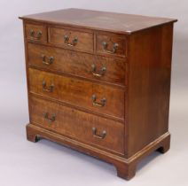 A Georgian-style small mahogany chest fitted three short & three long graduated drawers with brass