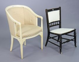 A continental-style cream painted wooden-frame tub-shaped chair with a padded seat & arms, & on
