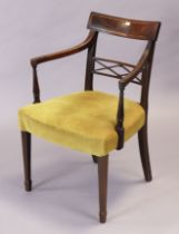 A 19th century inlaid-mahogany bow-back carver chair with a padded seat, & on square tapered legs.