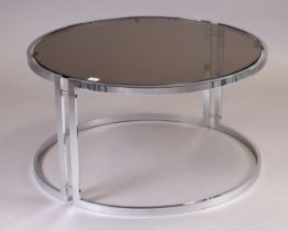 A silvered-metal circular low coffee table with a smoked-glass top, 70cm diameter & 42cm high.