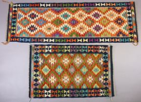 A Kilim corridor runner of multi-coloured geometric design, 197cm x 63cm; & a similar rug, 121cm x