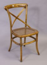 An Oka “Camargue” single chair with a woven cane seat, & on round legs.