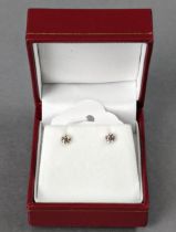 A pair of diamond solitaire ear studs weighing approx. 0.4 carat, set to 18k white mounts.