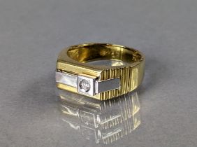 A heavy yellow & white metal gent’s ring (marked 750) of modernist design, the rectangular panel set