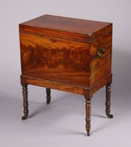A George III mahogany cellarette, the fitted interior enclosed by hinged-lid with Bramah lock, brass