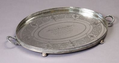 A LATE VICTORIAN SILVER LARGE OVAL TWO-HANDLED TRAY with engraved scroll border & inscription: “