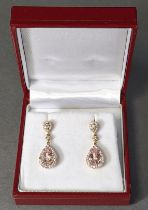 A pair of morganite & diamond drop earrings, the pink pear-shaped stones weighing approx 2.59