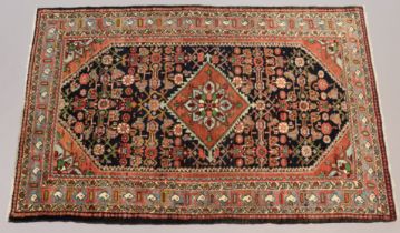 A northwest Persian Malayer rug of indigo ground with a central medallion surrounded by floral