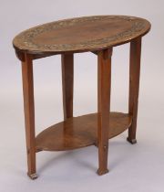 An arts & crafts walnut two-tier oval occasional table with carved thistle decoration, on square