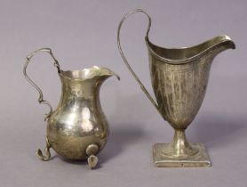 A George III silver helmet-shaped cream jug with pricked line decoration & shield cartouche, loop