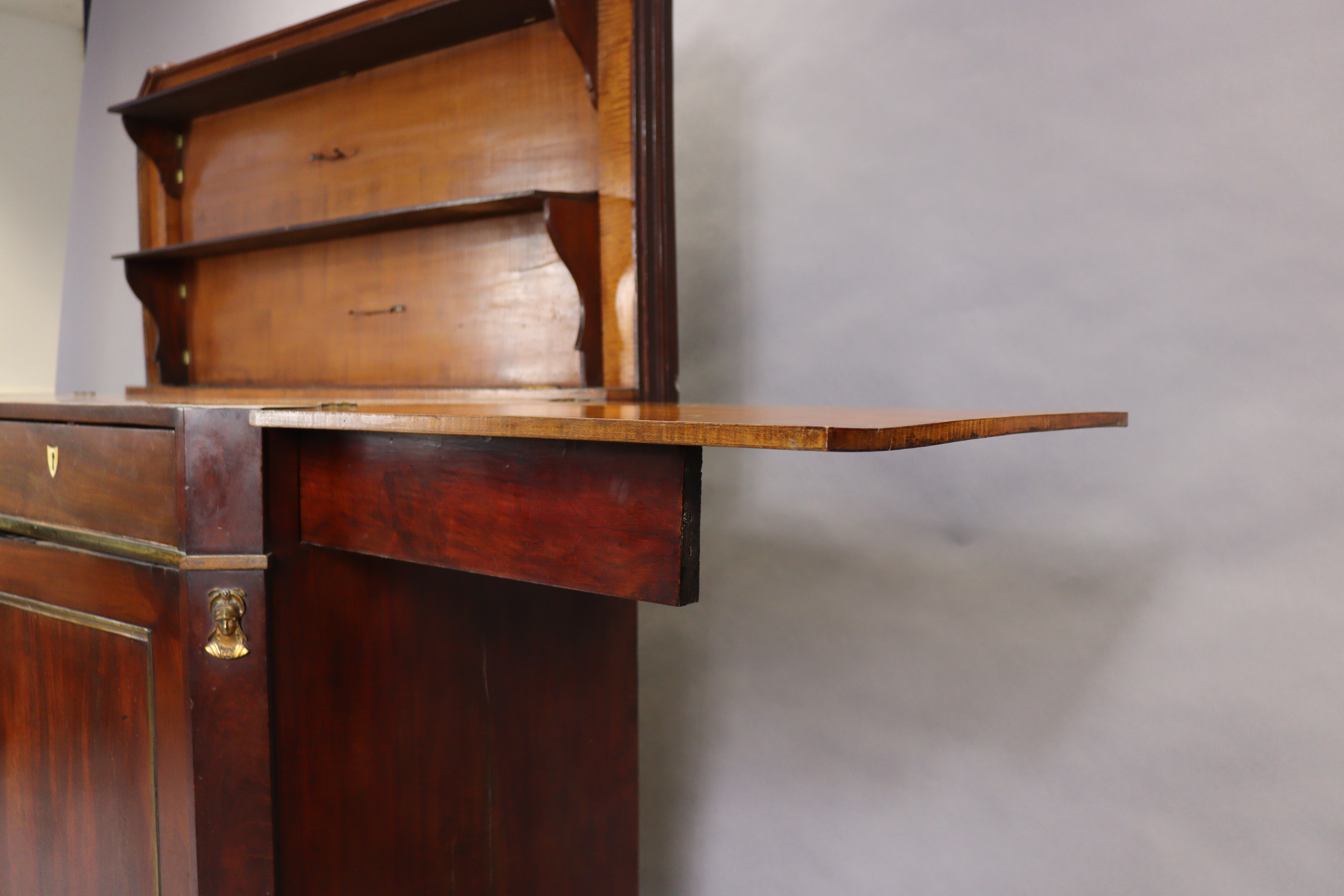 An early 19th century French mahogany buffet, the hinged top enclosing folding shelves, two frieze - Image 6 of 14