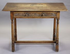 An early 18th century style oak side table with rectangular overhang top above a frieze drawer
