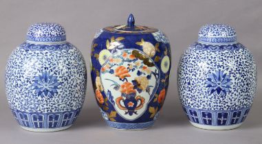 A pair of modern Chinese blue & white ginger jars & covers; and another jar & cover of blue ground,