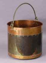 A 19th century copper & brass cylindrical log bucket with overhang swing handle, 33cm high x 37cm