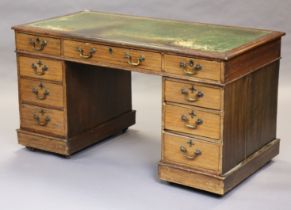 A Victorian mahogany and beech pedestal desk inset tooled green leather surface, fitted an