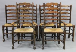 A set of six 19th century oak Lancashire-type rush-seat dining chairs with ladder-backs on turned