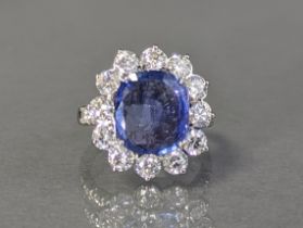 A SAPPHIRE & DIAMOND RING, the large cushion-shaped sapphire weighing approx 4.9 carats, set