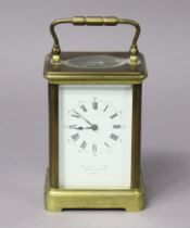 A late 19th century brass-cased carriage clock retailed by Howell James & Co., London, 9cm wide x