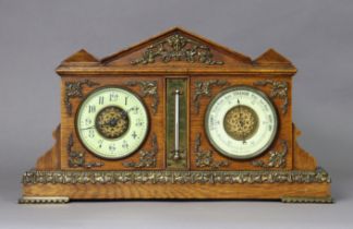 A late Victorian oak & brass-mounted combination desk timepiece/thermometer/barometer in