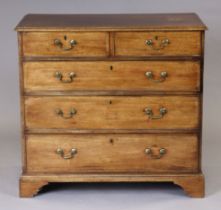A George III mahogany chest fitted two short and three long graduated drawers with brass swan-neck