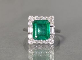 AN EMERALD & DIAMOND RING, the large rectangular step-cut emerald weighing approx 2.66 carats, set