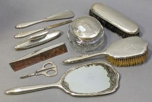 A silver-mounted hand mirror & hairbrush with engine-turned & engraved decoration; a similar nail