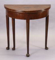 A mid/late-18th century mahogany demi-lune tea table with fold-over top supported by a gate-leg,