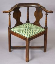 A Georgian mahogany corner chair with open splat back, padded drop-in seat and square legs with