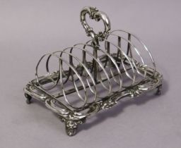 A William IV silver six-division toast rack with centre ring handle, kidney-shaped dividers,