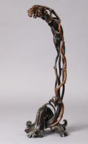 A 19th century Chinese lacquered or stained boxwood carving in the form of entwined branches &