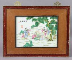 A 20th century Chinese famille rose porcelain plaque painted with scholar beneath a pine tree
