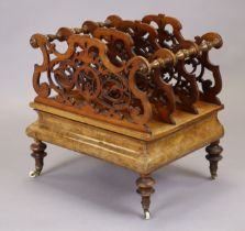 A mid-Victorian burr walnut canterbury with three shaped & pierced divisions on turned supports, the