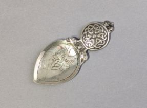 A Scottish Arts & Crafts silver caddy spoon by Alexander Ritchie, with engraved ovoid bowl, & Celtic