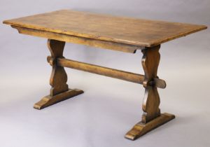 An early/mid-20th century oak refectory dining table with single board top, on shaped & pierced