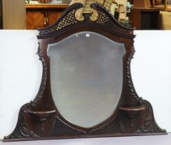 A Chippendale-style mahogany overmantel mirror with a pierced swan-neck cornice, & inset with a