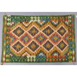 A Chobi Kilim rug of multi-coloured geometric design 132cm x 85cm.